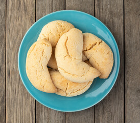 Chipas, typical south american cheese bun over wooden table