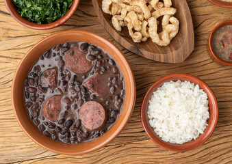 Typical brazilian feijoada with rice, kale and cracklings