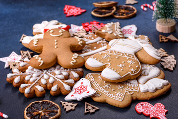 Christmas homemade gingerbread cookies on dark concrete table