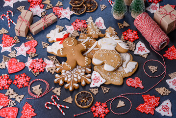 Christmas homemade gingerbread cookies on dark concrete table