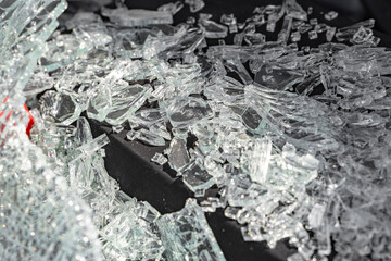Close-up of the broken windshield on the car. Cracks in the glass after a car accident. close-up