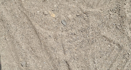 Fototapeta na wymiar Sand background. Texture of river sand.