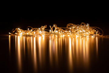 The Christmas garland shines and reflects. New Year's background