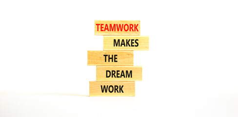 Teamwork makes the dream work symbol. Concept words Teamwork makes the dream work on wooden blocks on a beautiful white table white background. Business Teamwork makes dream work concept. Copy space.