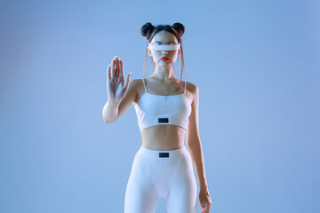Woman in futuristic sport costume. Augmented reality game, future technology, AI concept. VR. Neon...