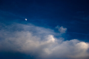 Moon and clouds and blue sky at summer night