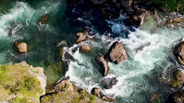 Aerial view of the Adda river with rough water and a lots of rapids, Northern Italy