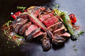 Traditional barbecue dry aged wagyu porterhouse beef steak bistecca alla Fiorentina with grilled...