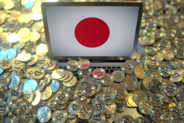 Laptop with flag of Japan and pile of bitcoins. Cryptocurrency mining and national regulations concepts, 3d rendering