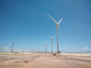 Beautiful view to wind turbines on wind farm in Lençóis Maranhenses - obrazy, fototapety, plakaty