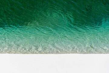 Beautiful view to blue rainwater lagoon and white sand dunes © Cavan