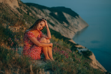 portrait of a young woman in the summer in the mountains