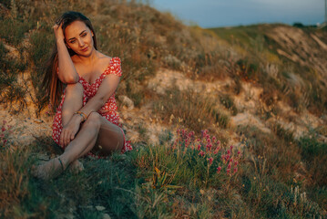 portrait of a young woman in the summer in the mountains