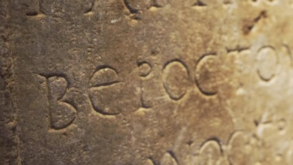 Ancient Greek manuscript engraved in stone. Inscription in ancient Greek. High quality 4k footage