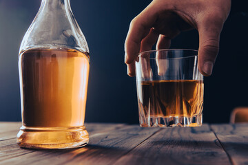 men holding a glass of whiskey