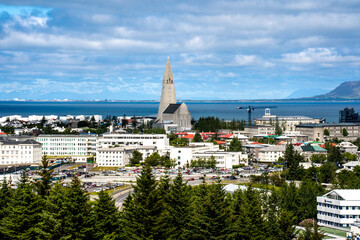 Reykjavik, Iceland - July 4, 2022 A panoramic view of the city's skyline and the iconic...