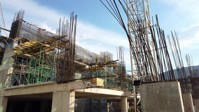 Laborers working on modern constraction site works