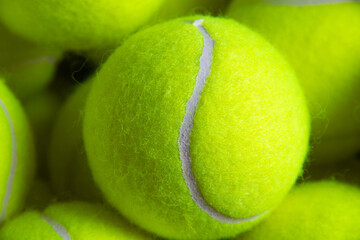 Close up of tennis balls, yellow terry cloth texture, racket sports