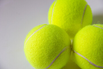 Close up of tennis balls, yellow terry cloth texture, racket sports