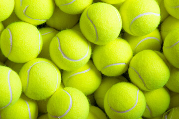 Close up of tennis balls, yellow terry cloth texture, racket sports