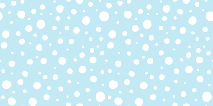 Fototapeta Seamless playful hand drawn light blue and white polka dot, snow or animal spots fabric pattern. Abstract geometric circle background texture. Boy's birthday, baby shower or nursery wallpaper design.