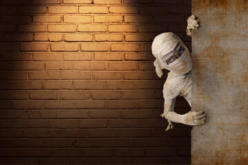 Mummy coming from behind the wall