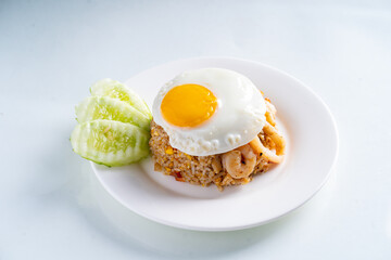 fried rice with seafood and egg in white dish on white background, Thai food, isolated background