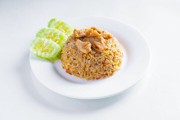 Fried rice with pork in white dish on white background, Thai food, isolated background