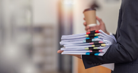 Business Documents, Auditor businesswoman holding document in hand legal prepare paperwork or...