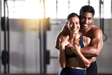 Strong, active and wellness couple looking fit and healthy after workout training session in a gym....