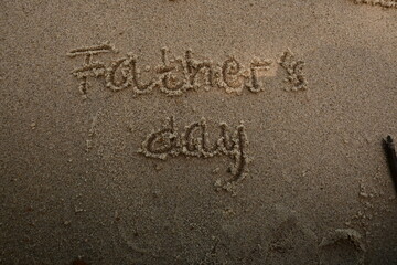 father's day writing on the beach sand