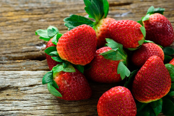 Fresh strawberries on wood, top view