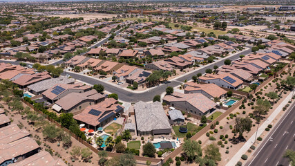 Afternoon aerial view of single family housing neighborhood near downtown Goodyear, Arizona, USA.