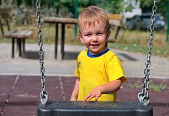 Portrait of sweet little boy on playground