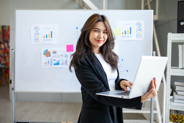 Portrait of Asian beautiful business woman working at the office, using computer. buiness concept. - 524383168