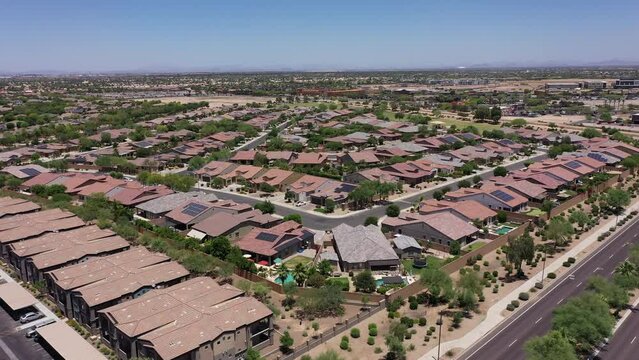 Afternoon aerial view of single family housing neighborhood near downtown Goodyear, Arizona, USA.