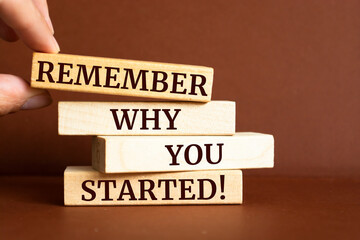 Wooden blocks with words 'Remember Why You Started'.
