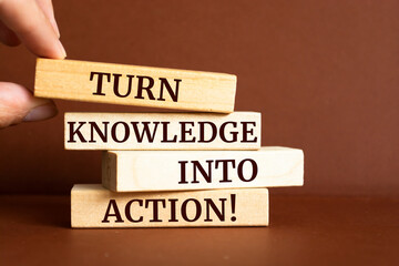 Wooden blocks with words 'Turn Knowledge Into Action'.