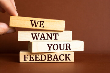 Wooden blocks with words 'We Want Your Feedback'. Business concept