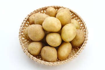 A pile of fresh organic baby potatoes, on white background. 
