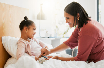 Diabetes, insulin and diabetic happy girl getting injected by her mom in her bedroom for their morning routine at home. Family, mom and kid smiling, medicating and using a finger stick for blood test