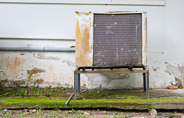 Old air conditioner installed outside the building