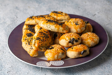 Turkish style pastry with olives and dill cheese pastry (Turkish name; Zeytinli pogaca ve dere otlu peynirli pogaca)