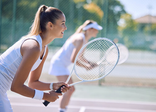 Female tennis player or sports woman with racket and sports gear playing a match outdoors sport court. Fit young girl enjoying hobby, exercising or competitive activity with equipment or sporty gear