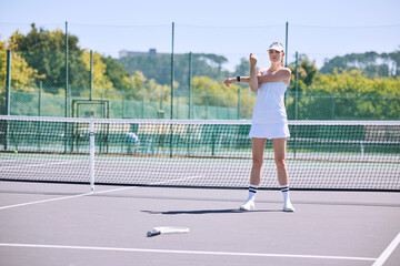 Obraz premium Fitness, tennis player and athlete stretching out arms before an exercise match, game or workout outside on the court. Young, active and sporty female in a sports club warming up ready for training