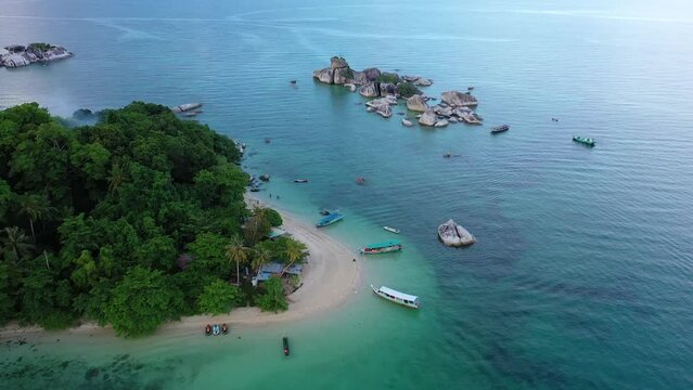 Belitung, Indonesia: Aerial drone footage of the stunning Kelayang island in Belitung in the Java sea in Indonesia, Southeast Asia. Shot with a tilt down motion. 