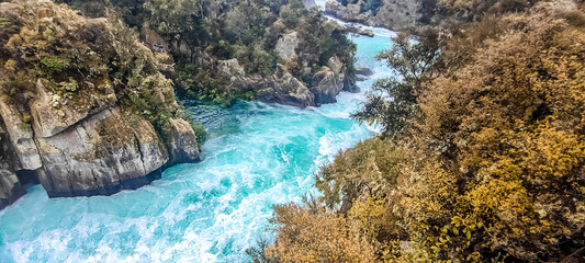 river rapids at huka falls near taupo or rotorua north island new zealand, landscape with water, rocks and trees