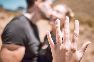 Engagement, proposal and romance while showing off her diamond ring and saying yes to marriage outside. Closeup hand of a young romantic couple telling you to save the date for their wedding day - obrazy, fototapety, plakaty