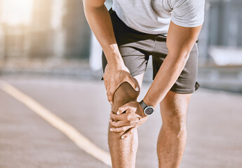 Runner training accident with joint pain, arthritis and tendon problems. Health, fitness and a sports injury with athlete man suffering from a fracture, broken leg and knee after a workout. - obrazy, fototapety, plakaty