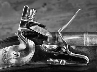Closeup of Antique Flintlock Gun in black and white.